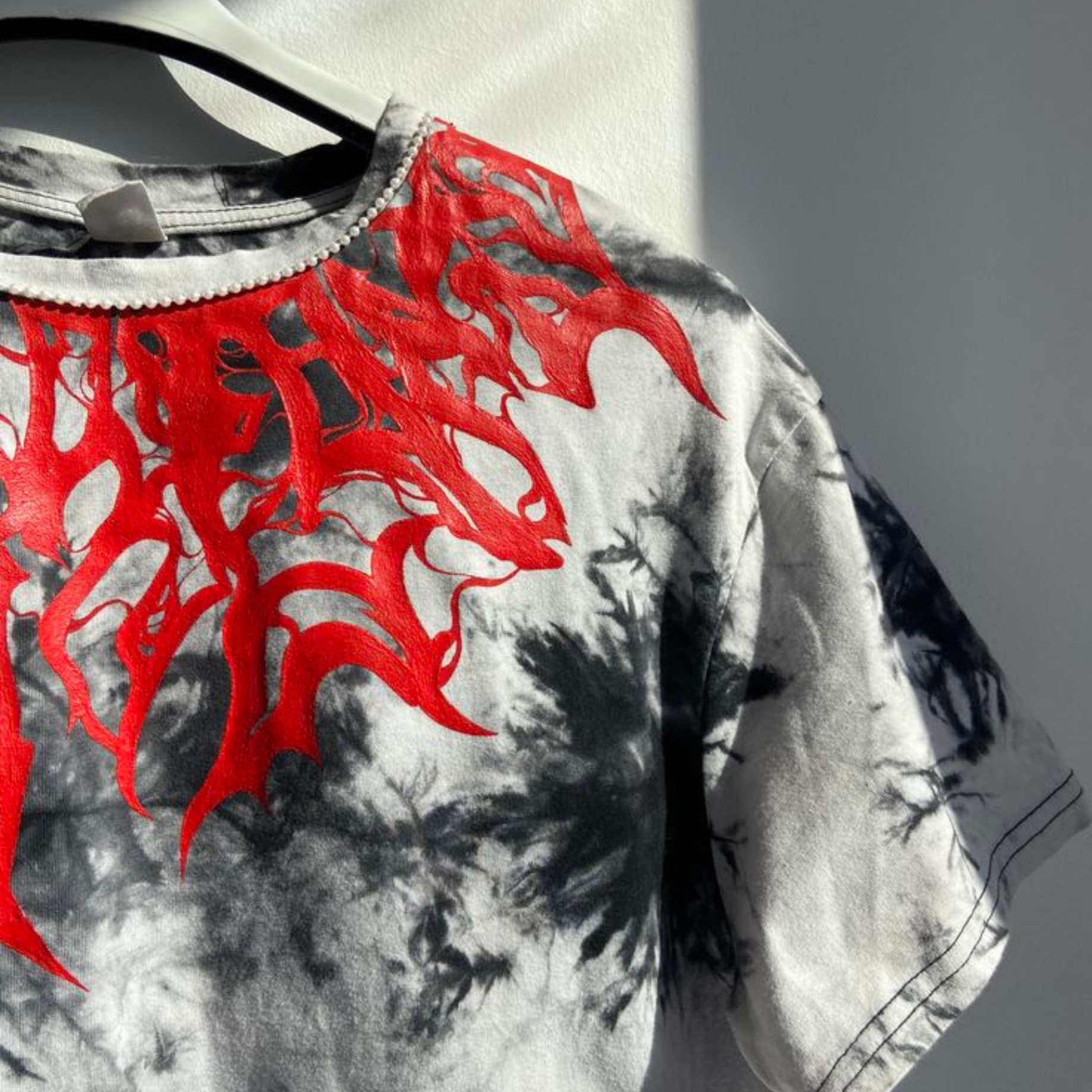 Graphic printed t-shirt featuring urban street art design in black